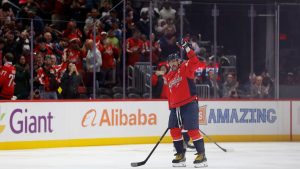 Alex Ovechkin becomes first NHL player to reach 900 goals as opposing goalie tries to hide milestone puck