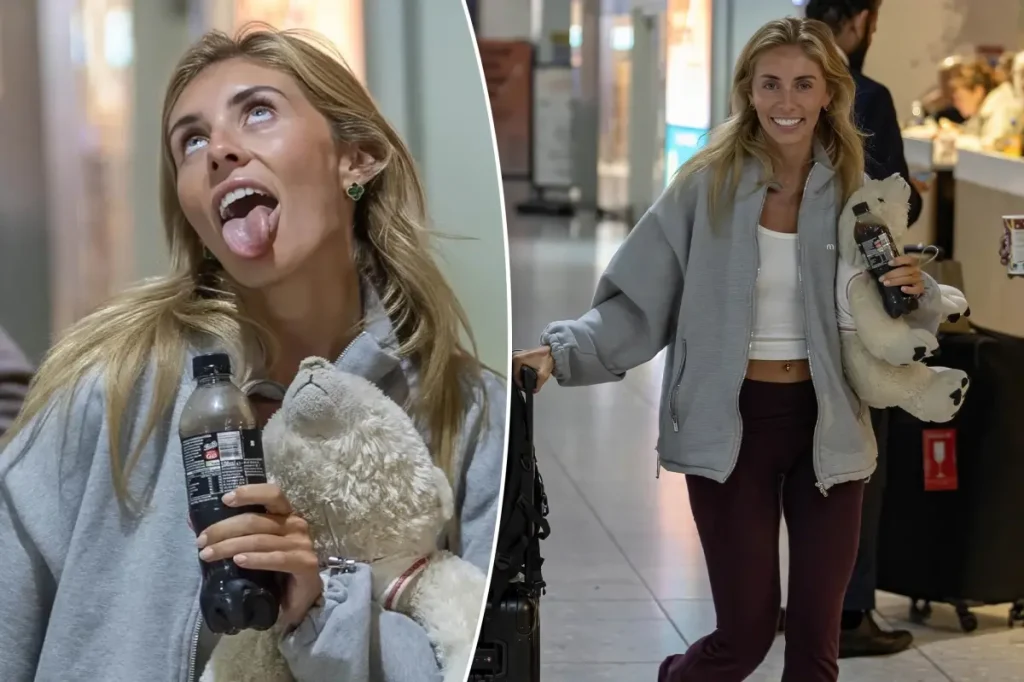 An unfazed Bonnie Blue poses for cameras upon arriving back in the UK after controversial Bali stunt