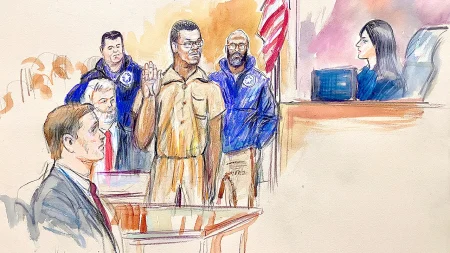 DC pipe bomb suspect makes first court appearance; family yells support