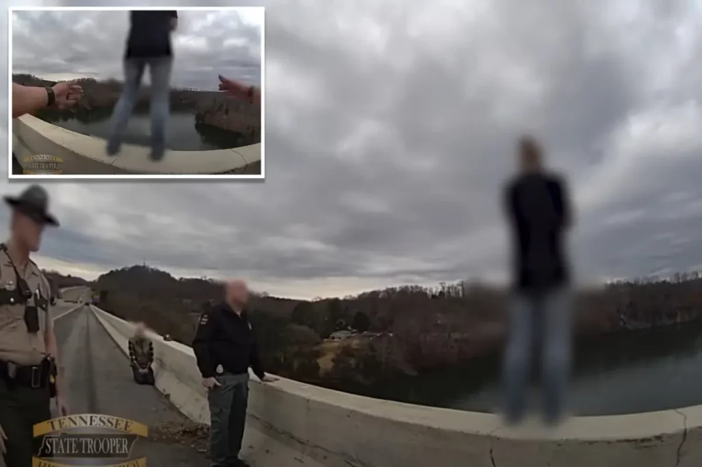Heart-pounding video captures moment cop stops distraught woman from leaping off bridge the day after Christmas