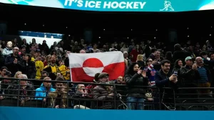 Olympic hockey fans raise Greenland’s flag during USA’s dominant win over Denmark, sparking viral reaction