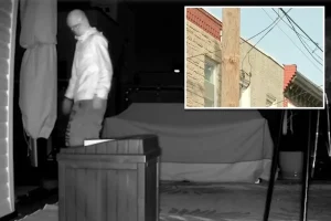 Masked man spotted lurking on top of Philadelphia home in dead of night