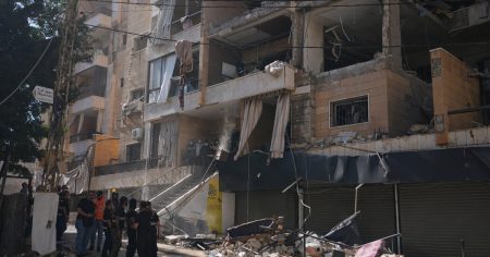 rewrite this title into a single title (don’t suggest multiple titles, just choose one, and don’t add “ to the title): Israel Bombs Beirut Outskirts as Fighting With Hezbollah Escalates