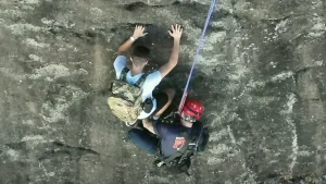 Free climber stranded on Georgia rock face calls 911, prompting dramatic rescue by firefighter