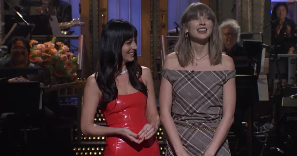 Taylor Swift Is Pretty in Plaid for Surprise ‘SNL’ Cameo With Host Dakota Johnson